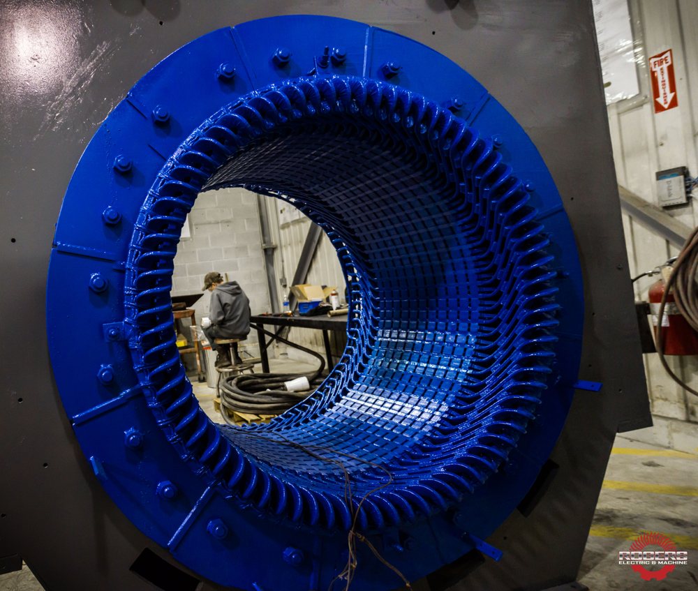 Technician working on an electric motor stator