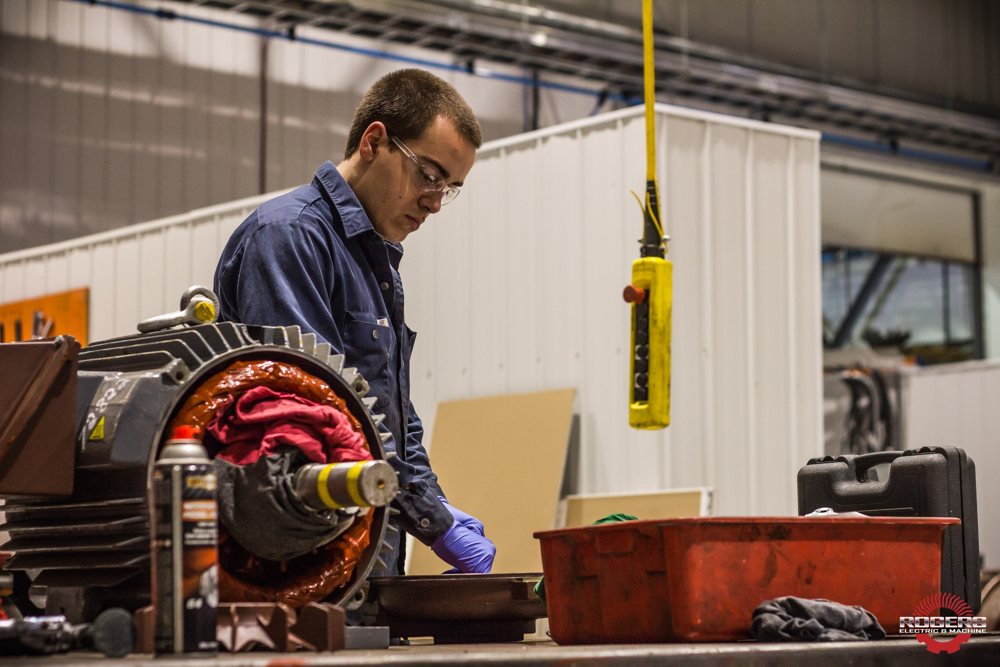 Hands rewinding a motor